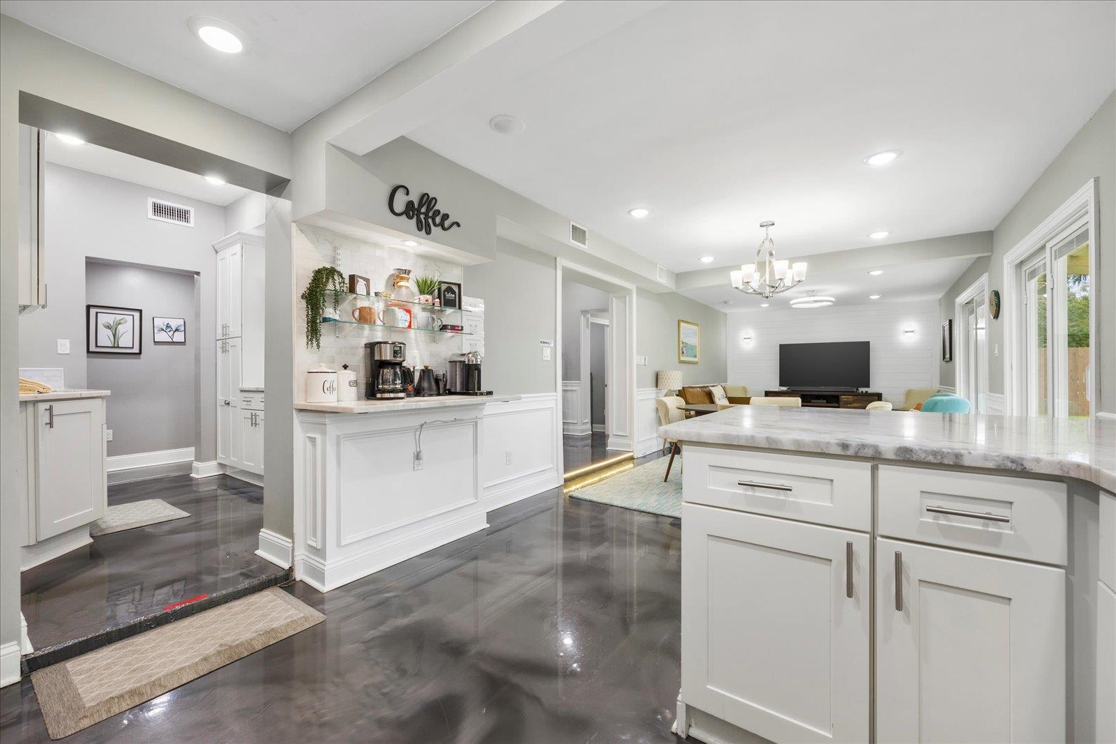 12 Dallyon Avenue St. Augustine, FL 32080 - Photo 19 of 60 a large white kitchen with a lot of counter space and wooden floor
