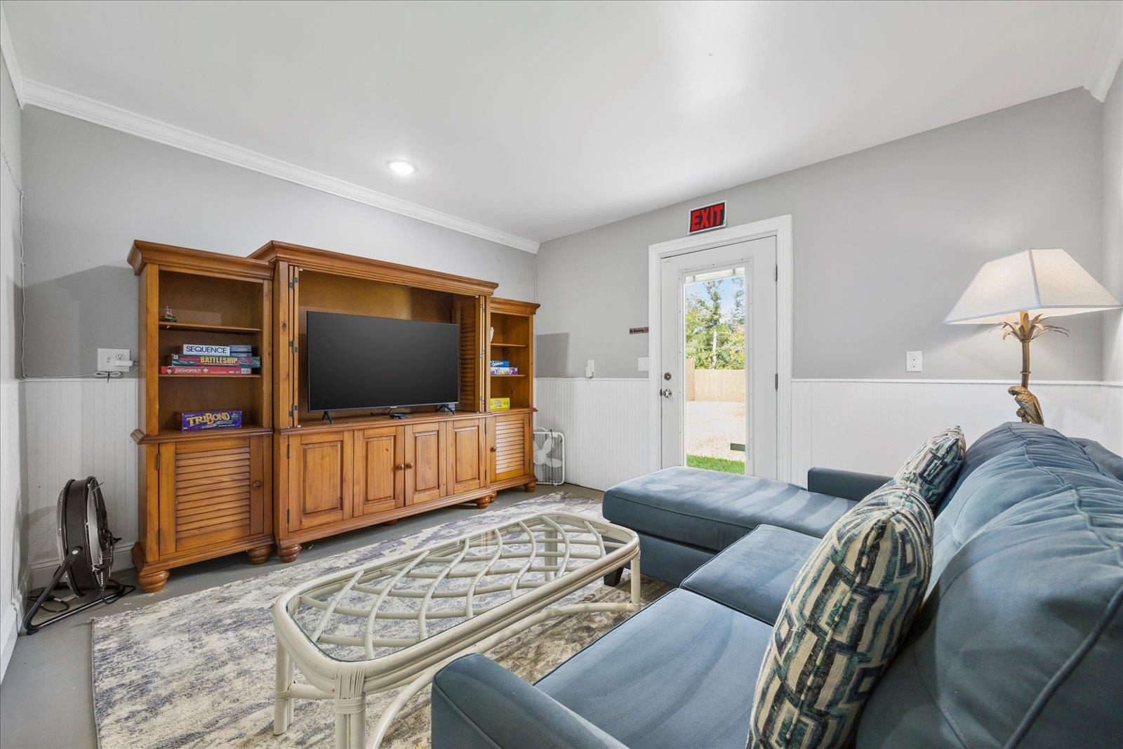 12 Dallyon Avenue St. Augustine, FL 32080 - Photo 32 of 60 a living room with furniture and a flat screen tv