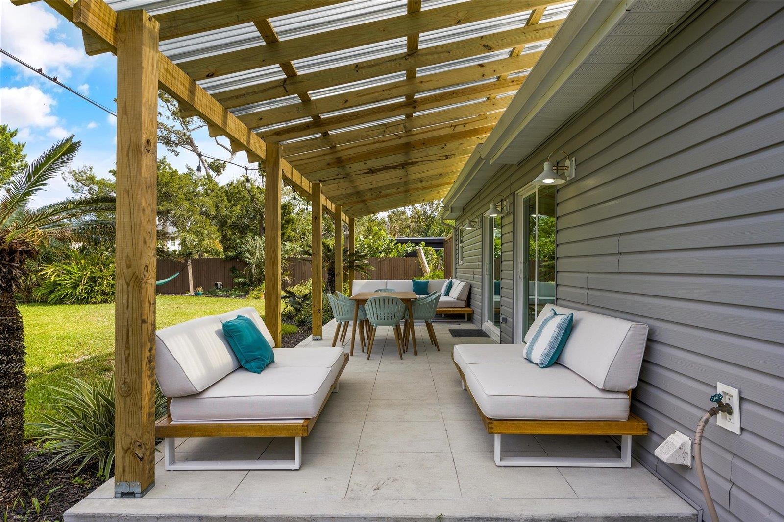 12 Dallyon Avenue St. Augustine, FL 32080 - Photo 39 of 60 a balcony with furniture and a garden