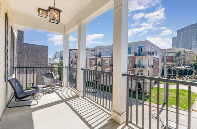 a view of a balcony with wooden floor
