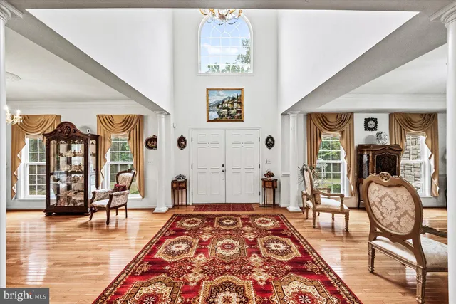 a living room with furniture flowerpot and a fireplace