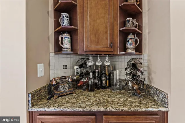 a bedroom with a bed and a view of kitchen