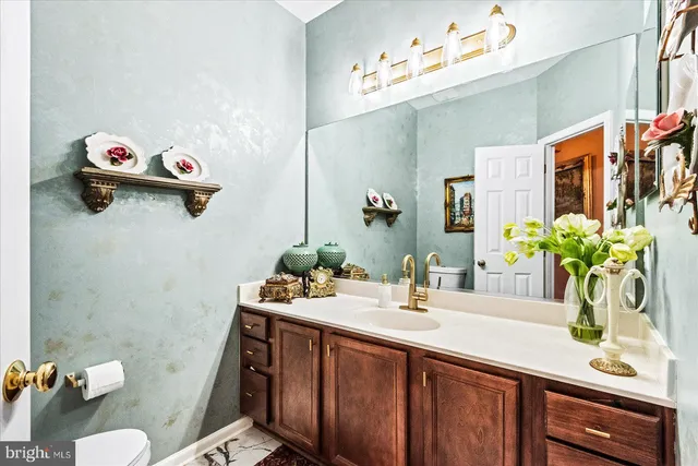 a living room with a bed furniture and a large window