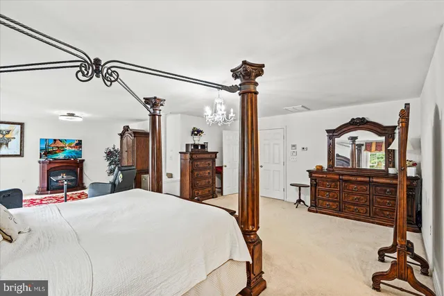 a living room with furniture and a piano