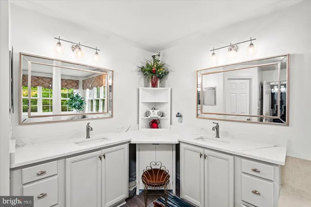 a bathroom with a sink a toilet and shower curtain