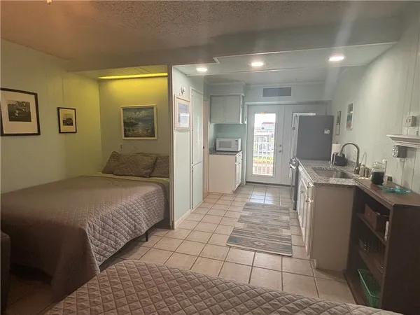 a bedroom with a bed and a table in it