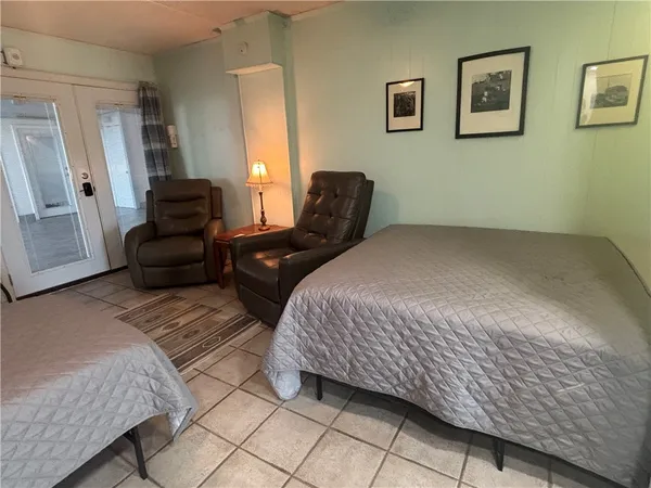 a bedroom with a bed and a couch