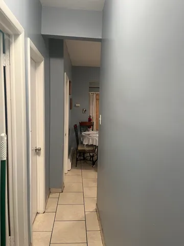 a bedroom with a bed and a television