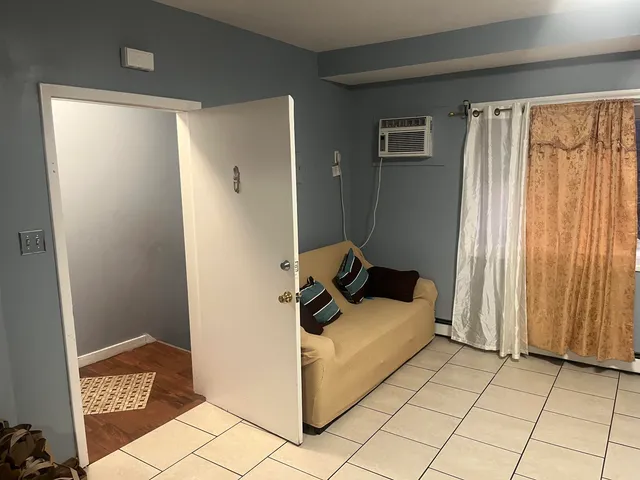 a bedroom with a bed and a shower