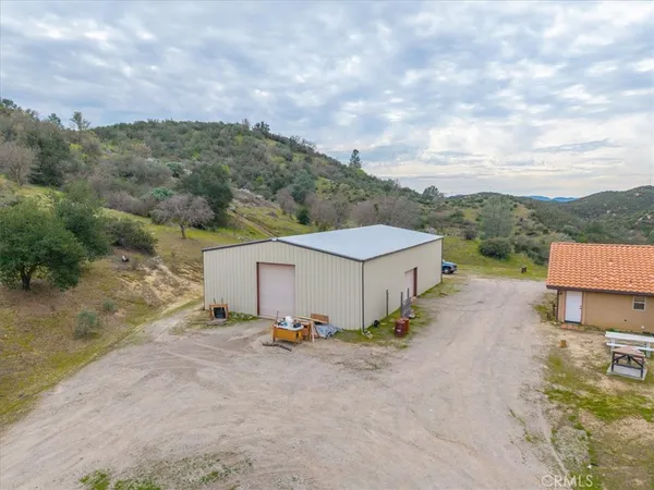 a view of a town with mountains in the background