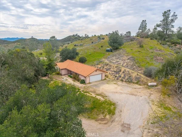 a view of an empty room and wooden floor