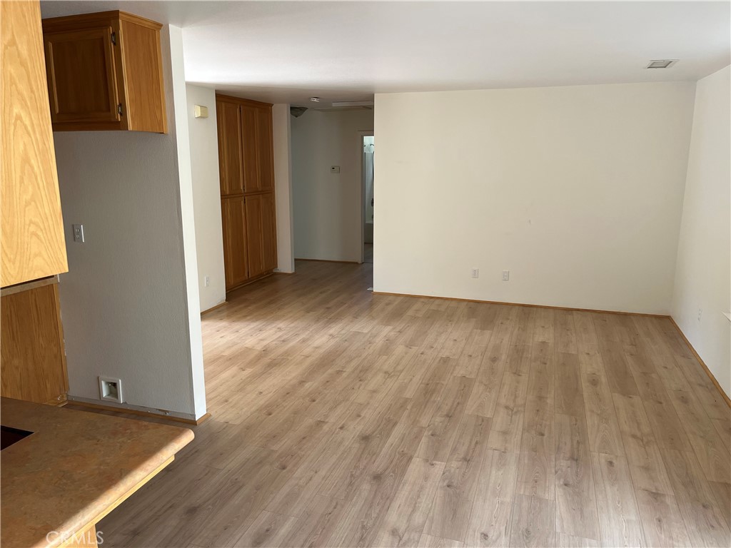3151 Parkhill Road Santa Margarita, CA 93453 - Photo 41 of 49 an empty room with wooden floor and windows