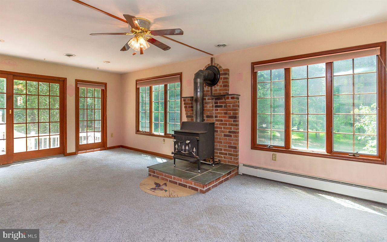 9 Lynn Ridge Court Manchester, MD 21102 - Photo 13 of 51 Large Windows and Cozy Woodstove