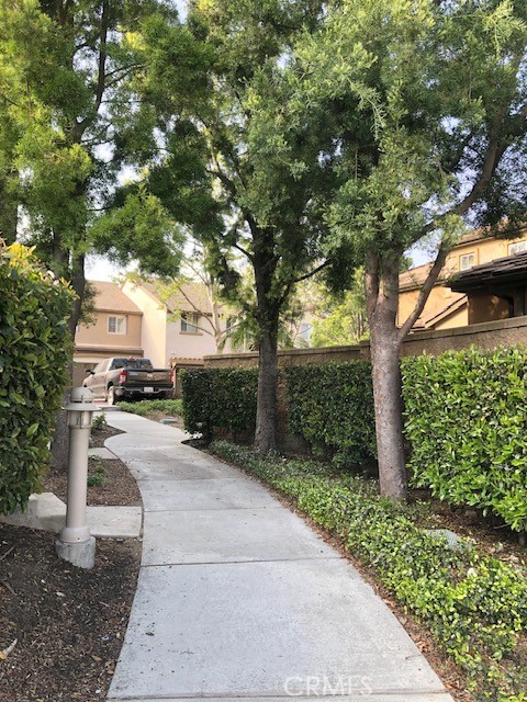 8692 East 9th Street, Unit 56 Rancho Cucamonga, CA 91730 - Photo 25 of 34 a view of a house with a tree in the background