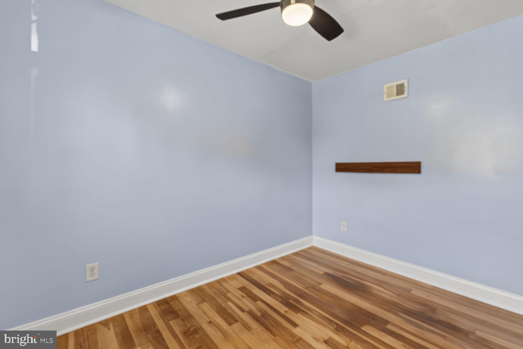 2437 Iverson Street Temple Hills, MD 20748 - Photo 13 of 15 a view of room with wooden floor