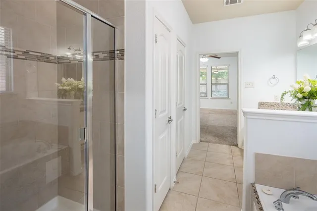a bathroom with a shower and a sink