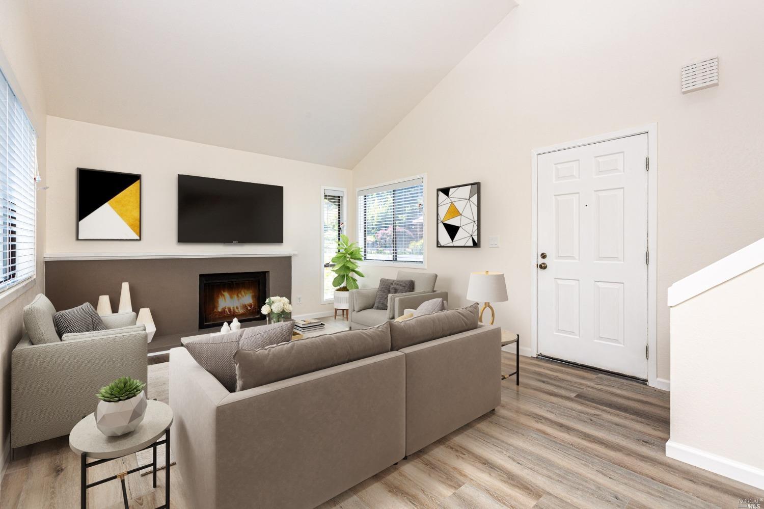 199 Cypress Place Sausalito, CA 94965 - Photo 3 of 12 a living room with furniture a fireplace and a flat screen tv