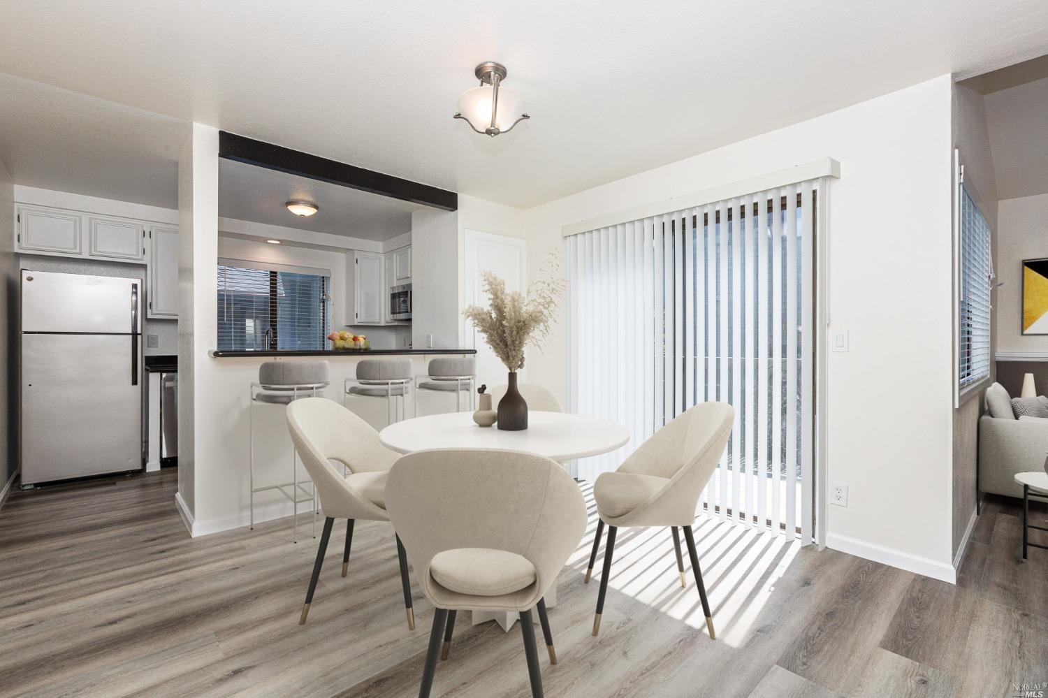 199 Cypress Place Sausalito, CA 94965 - Photo 4 of 12 a view of a dining room with furniture and wooden floor