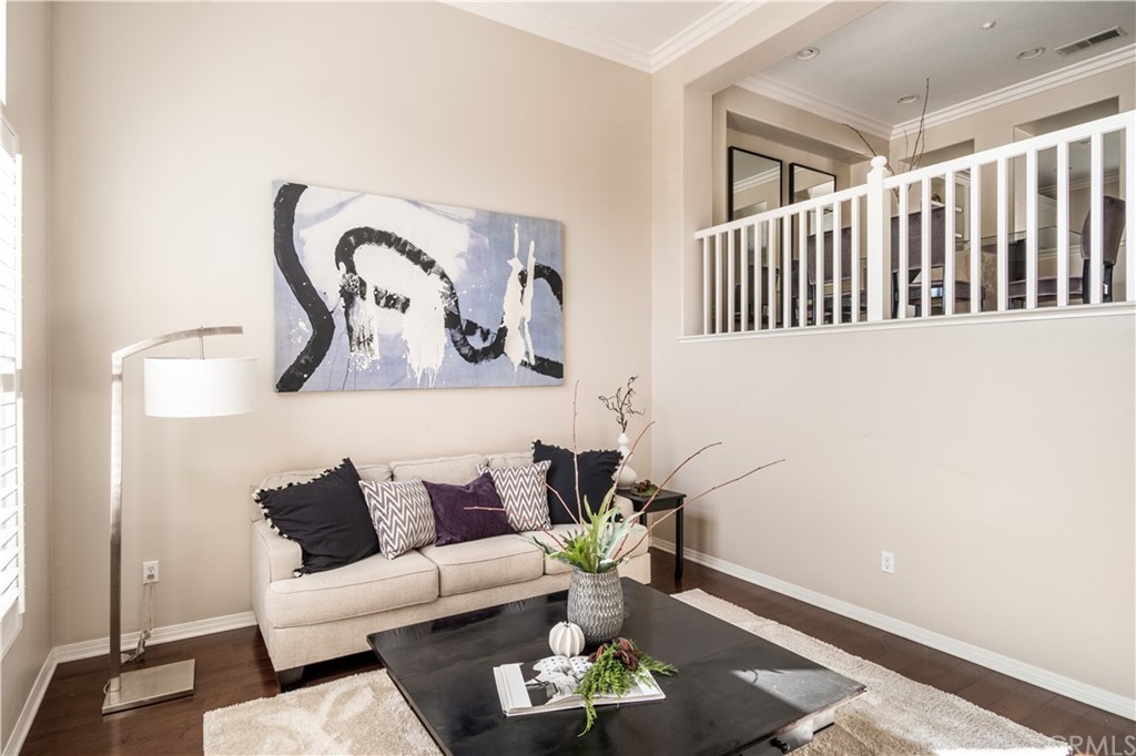 75 Spring Valley Irvine, CA 92602 - Photo 1 of 1 a living room with furniture and wooden floor