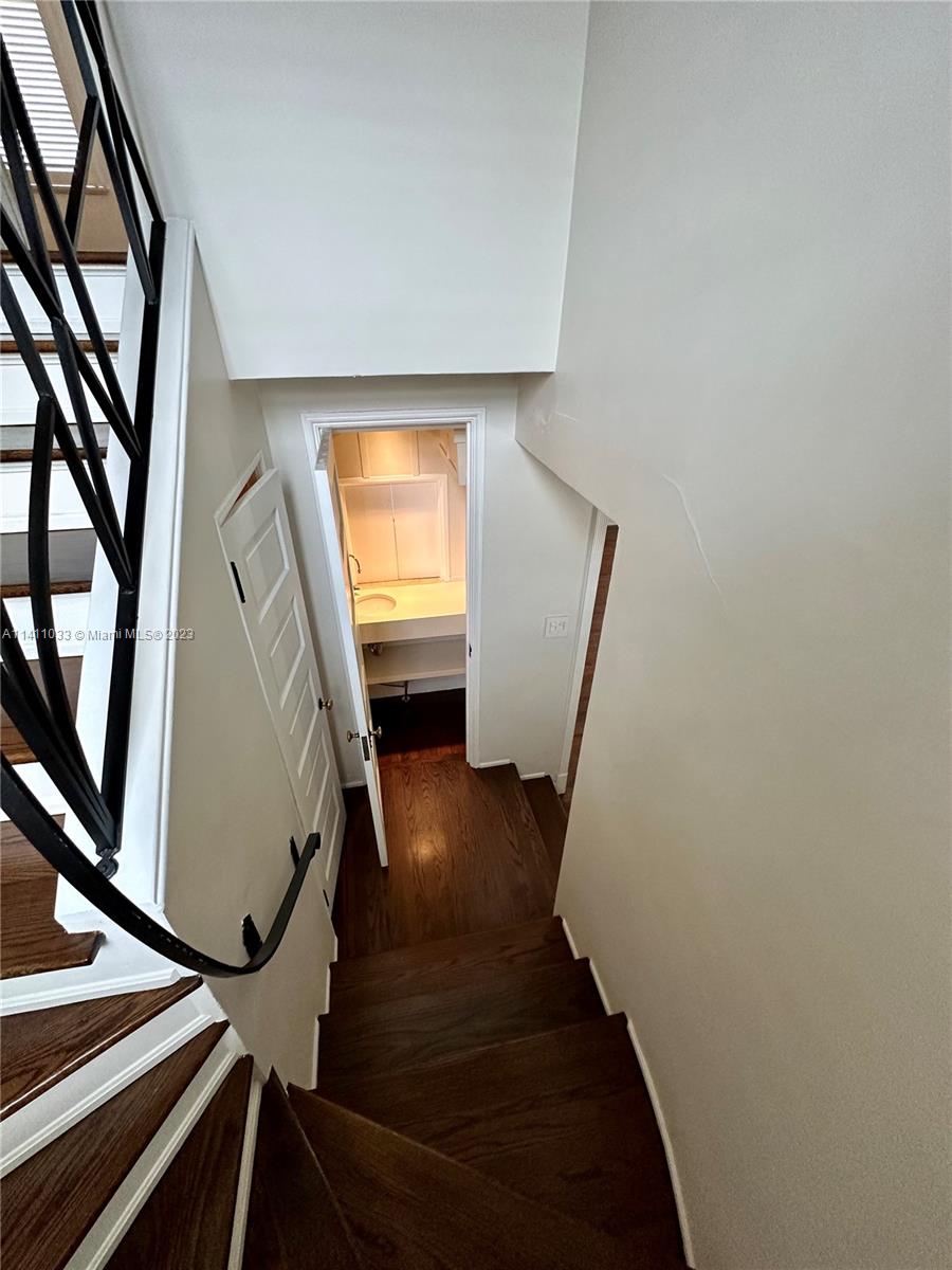 Mid Beach Miami Beach, FL 33140 - Photo 19 of 40 a view of entryway and hall with wooden floor