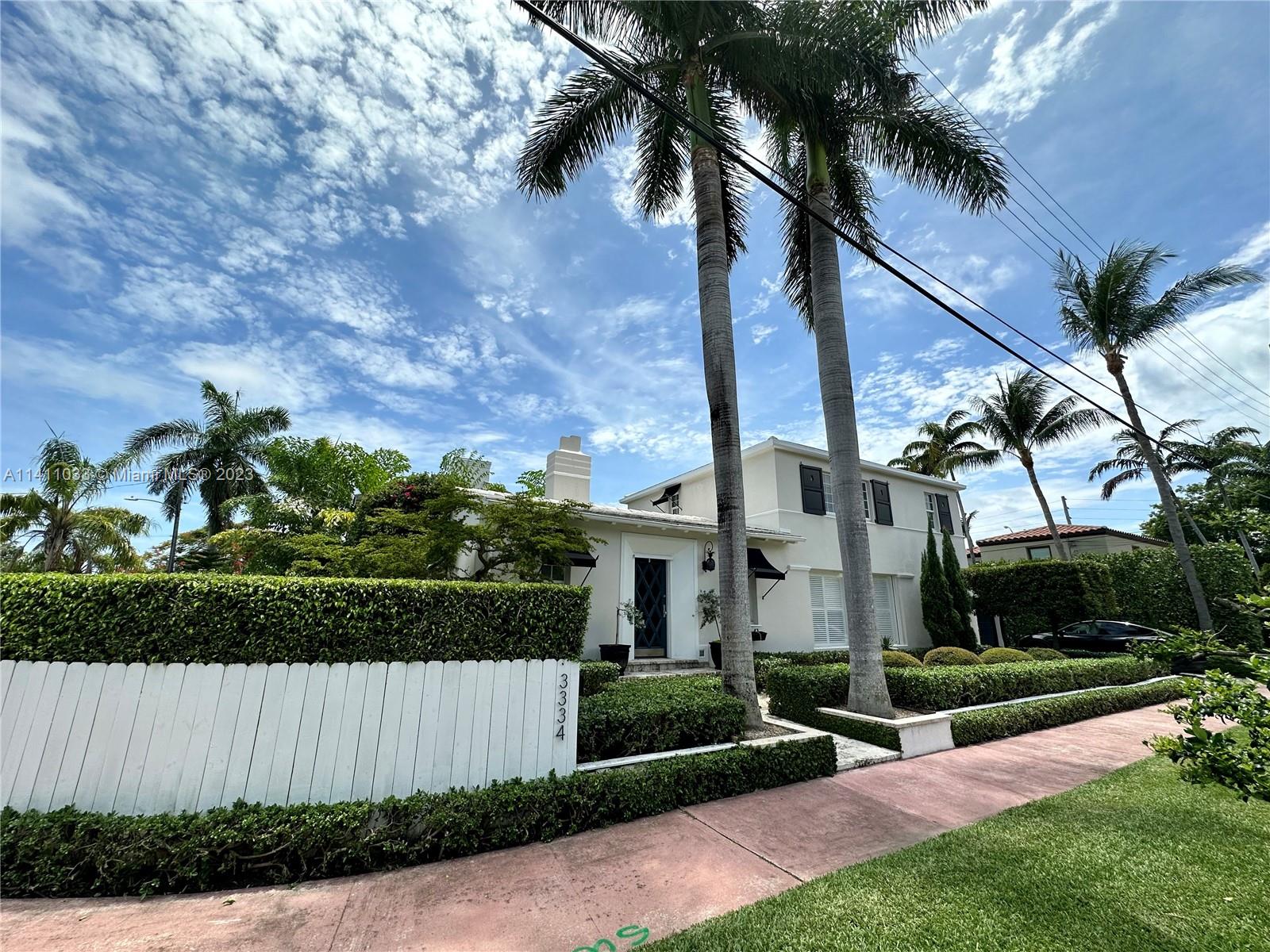 Mid Beach Miami Beach, FL 33140 - Photo 2 of 40 front view of house with a yard