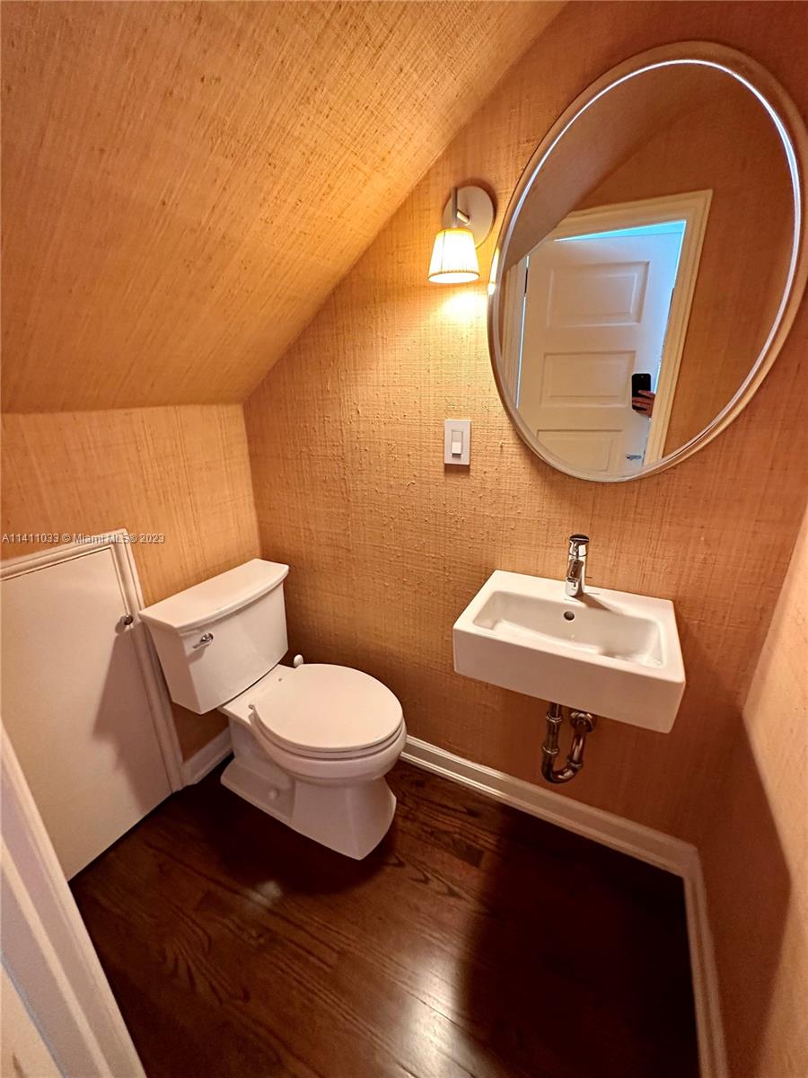 Mid Beach Miami Beach, FL 33140 - Photo 21 of 40 a bathroom with a sink and a mirror