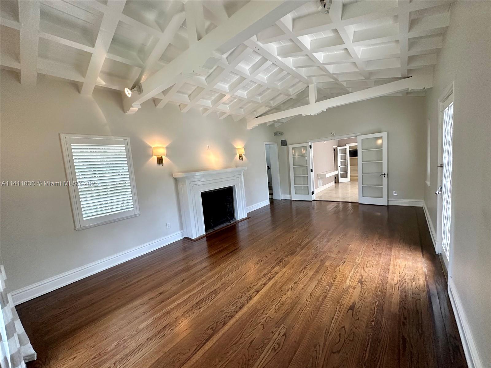 Mid Beach Miami Beach, FL 33140 - Photo 23 of 40 wooden floor in an empty room with a window