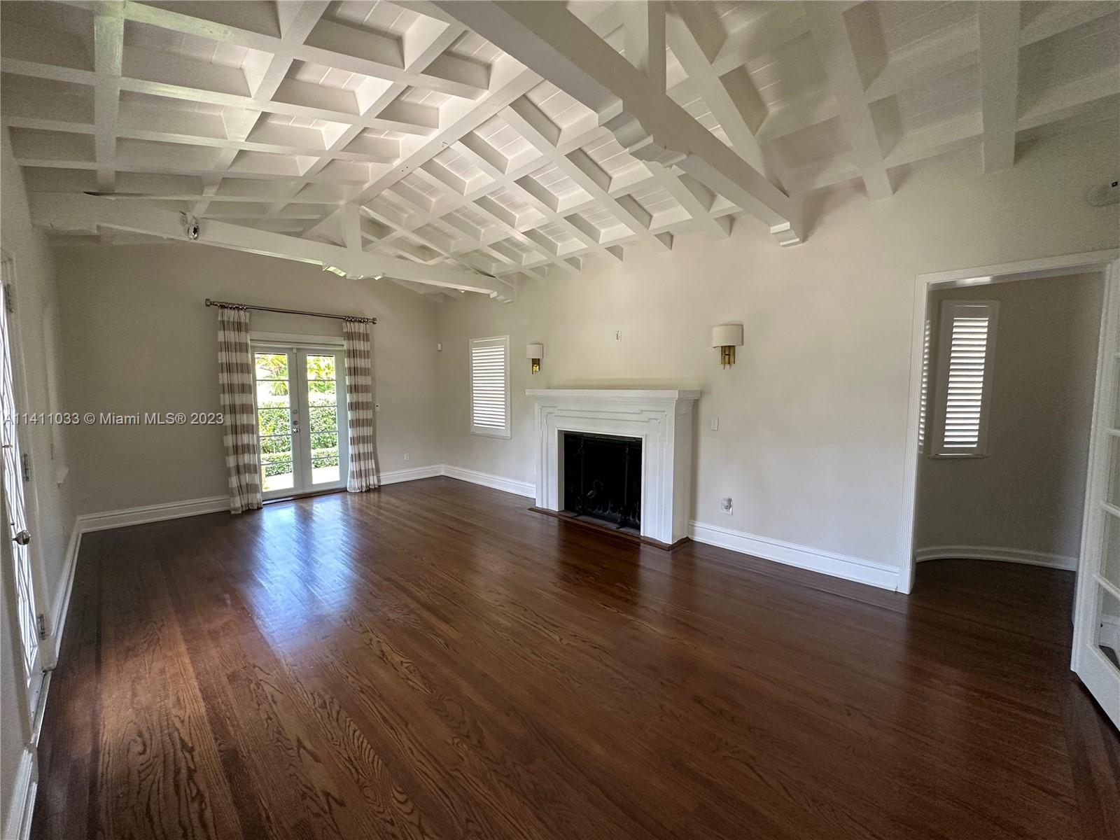 Mid Beach Miami Beach, FL 33140 - Photo 24 of 40 a view of an empty room with wooden floor and a window