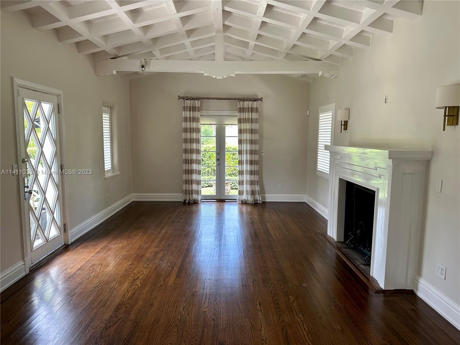 Mid Beach Miami Beach, FL 33140 - Photo 25 of 40 a view of an empty room with wooden floor and a window
