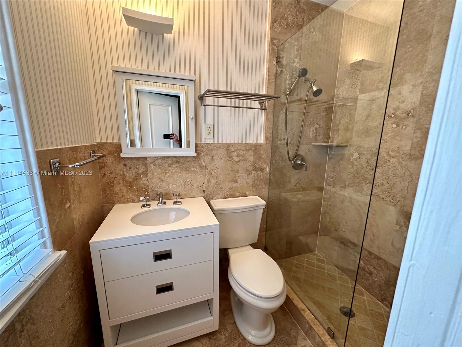 Mid Beach Miami Beach, FL 33140 - Photo 32 of 40 a bathroom with a sink toilet and shower