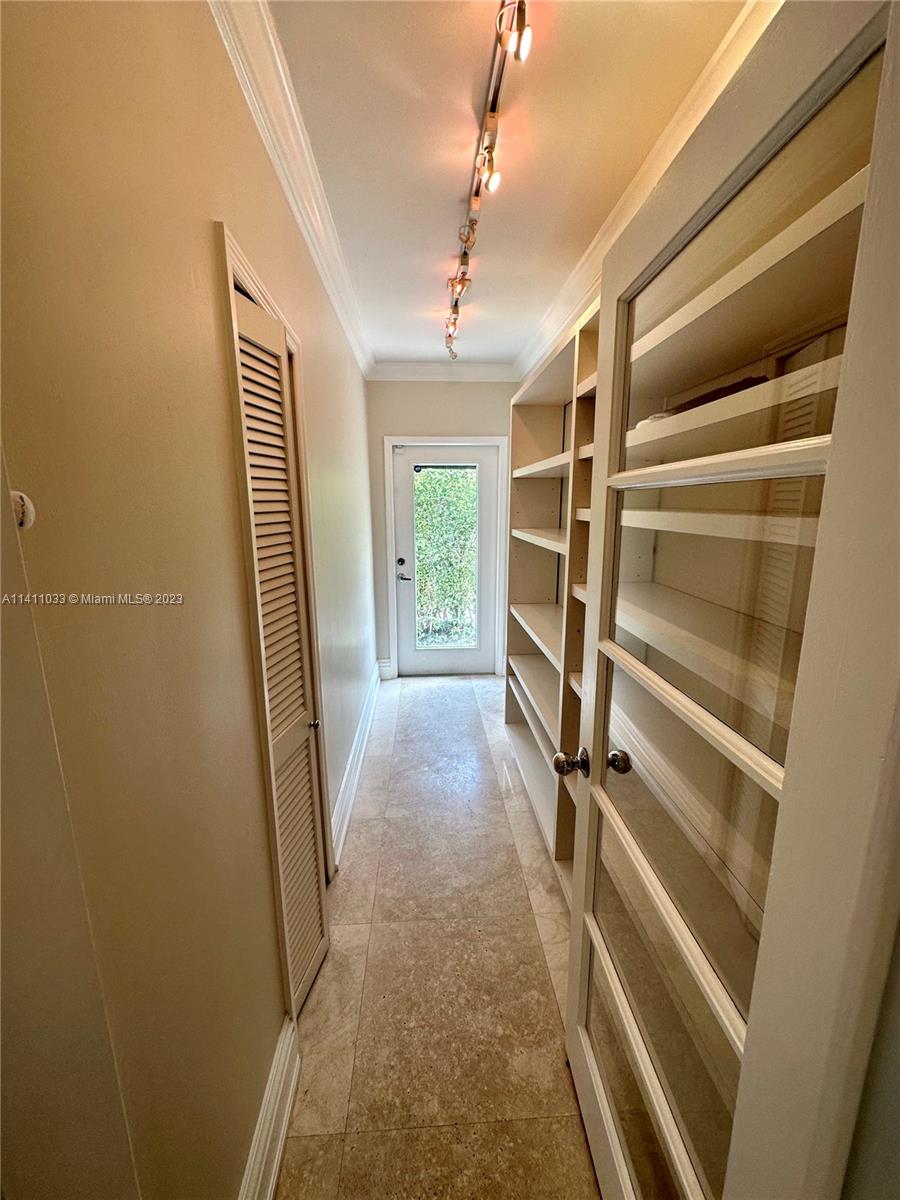 Mid Beach Miami Beach, FL 33140 - Photo 36 of 40 a view of walk in closet with empty racks