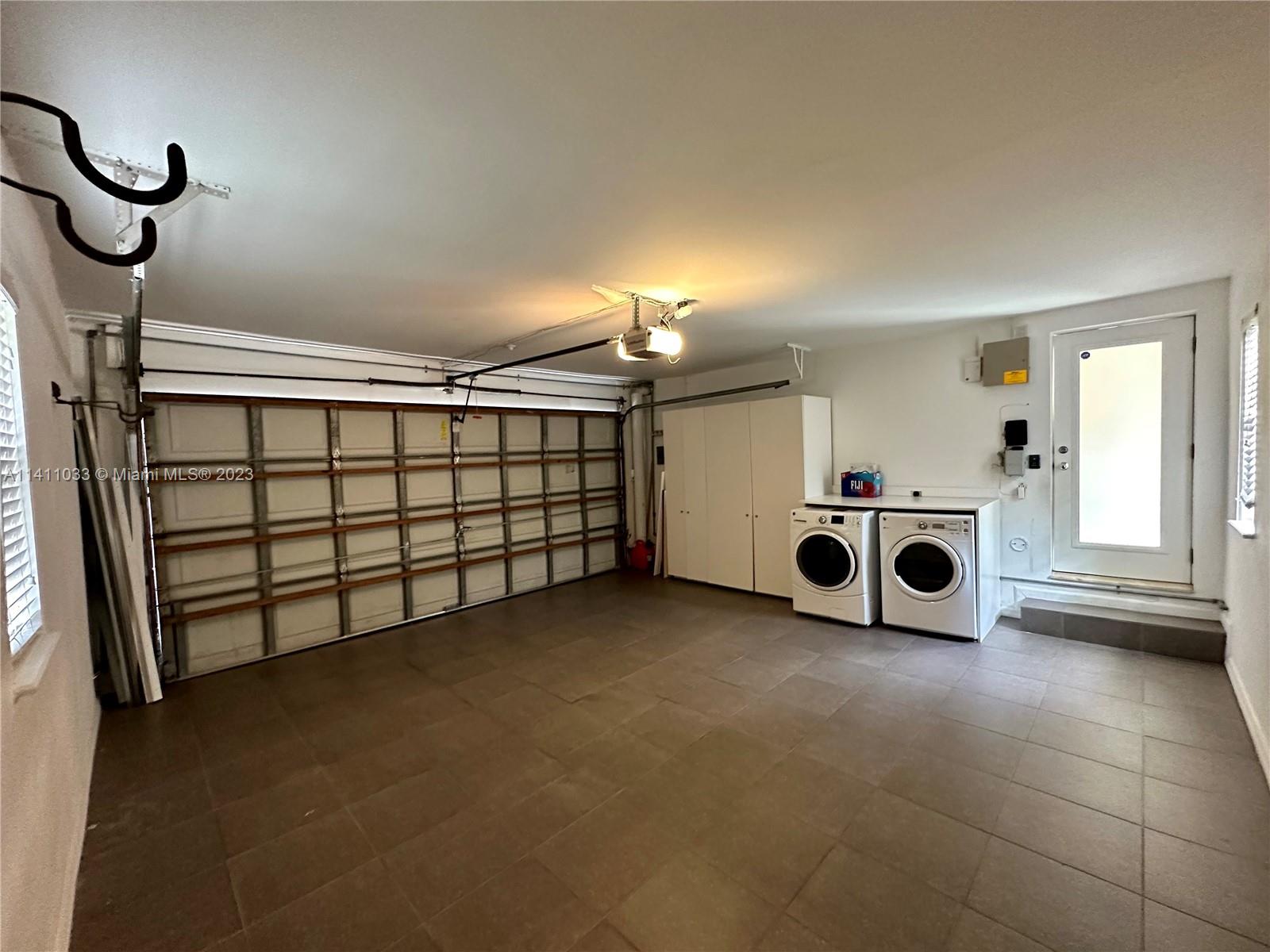 Mid Beach Miami Beach, FL 33140 - Photo 38 of 40 a view of a garage with washing machine