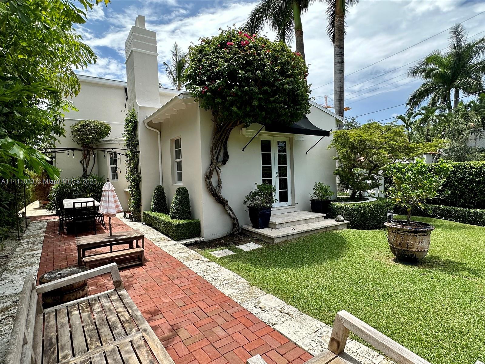 Mid Beach Miami Beach, FL 33140 - Photo 4 of 40 a view of a backyard with plants and a patio