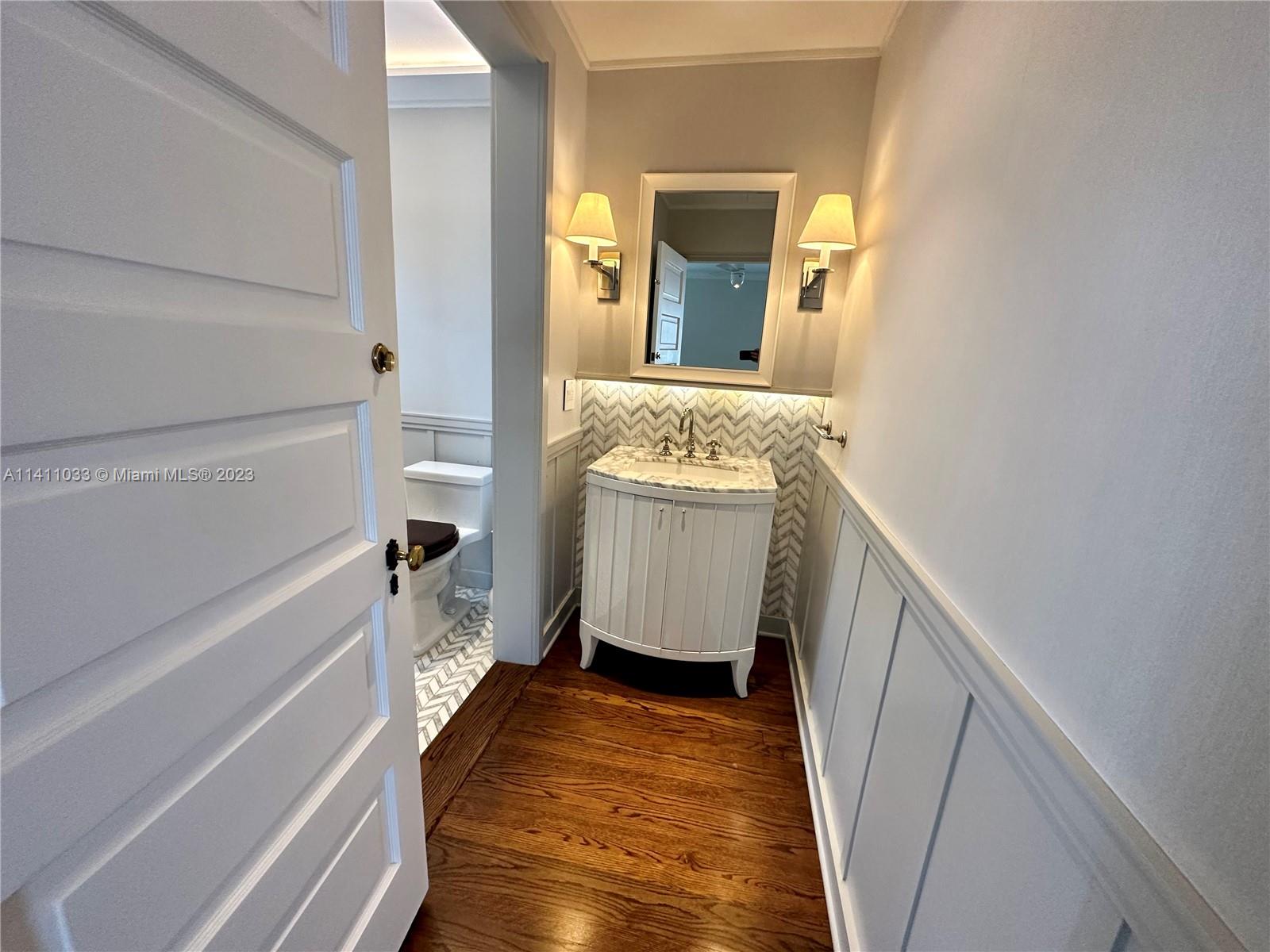 Mid Beach Miami Beach, FL 33140 - Photo 10 of 40 a bathroom with a sink and a mirror