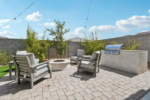 a view of a terrace with furniture and a potted plant