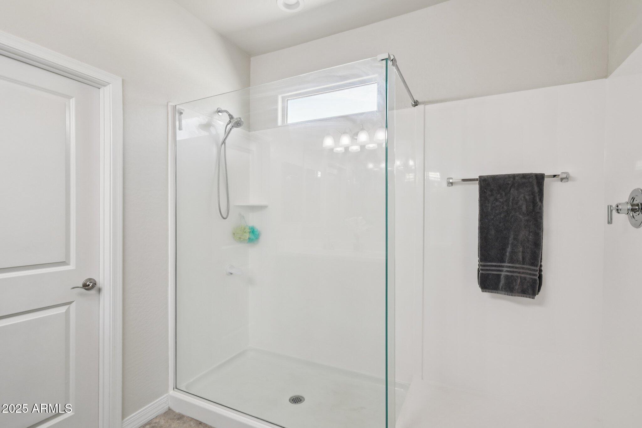 18819 West Farmer Road Buckeye, AZ 85326 - Photo 10 of 23 a bathroom with a shower