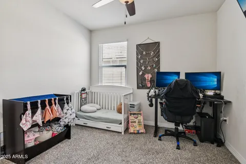 a bedroom with furniture and a window