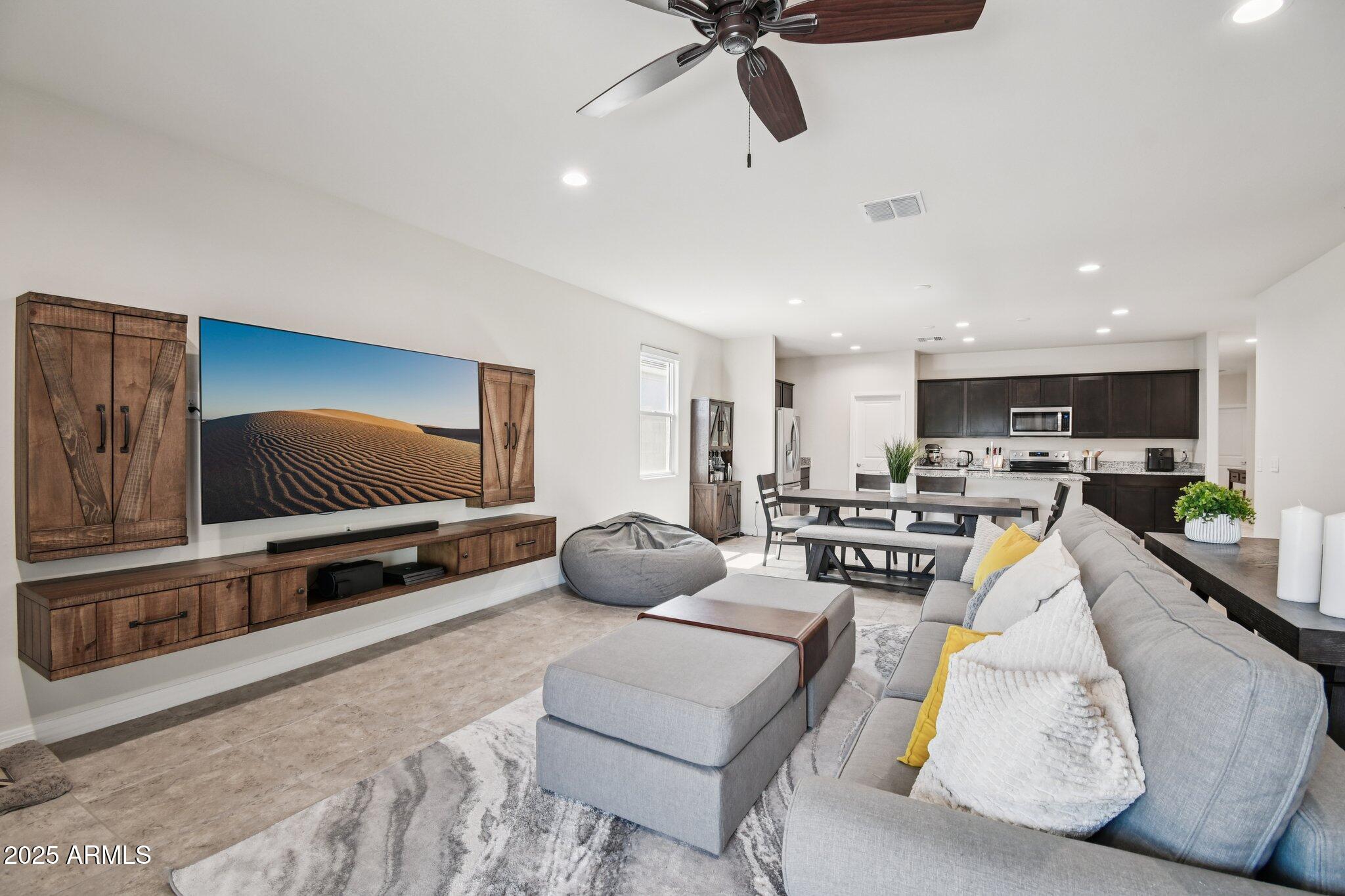 18819 West Farmer Road Buckeye, AZ 85326 - Photo 7 of 23 a living room with furniture and a flat screen tv