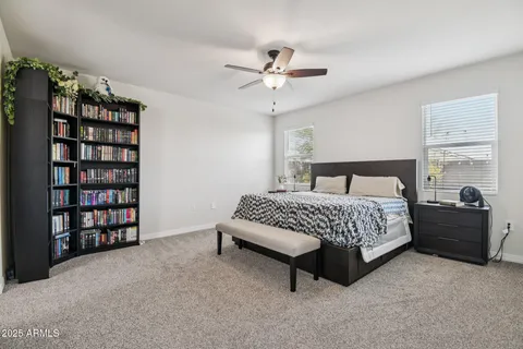 a bedroom with a bed furniture and decor
