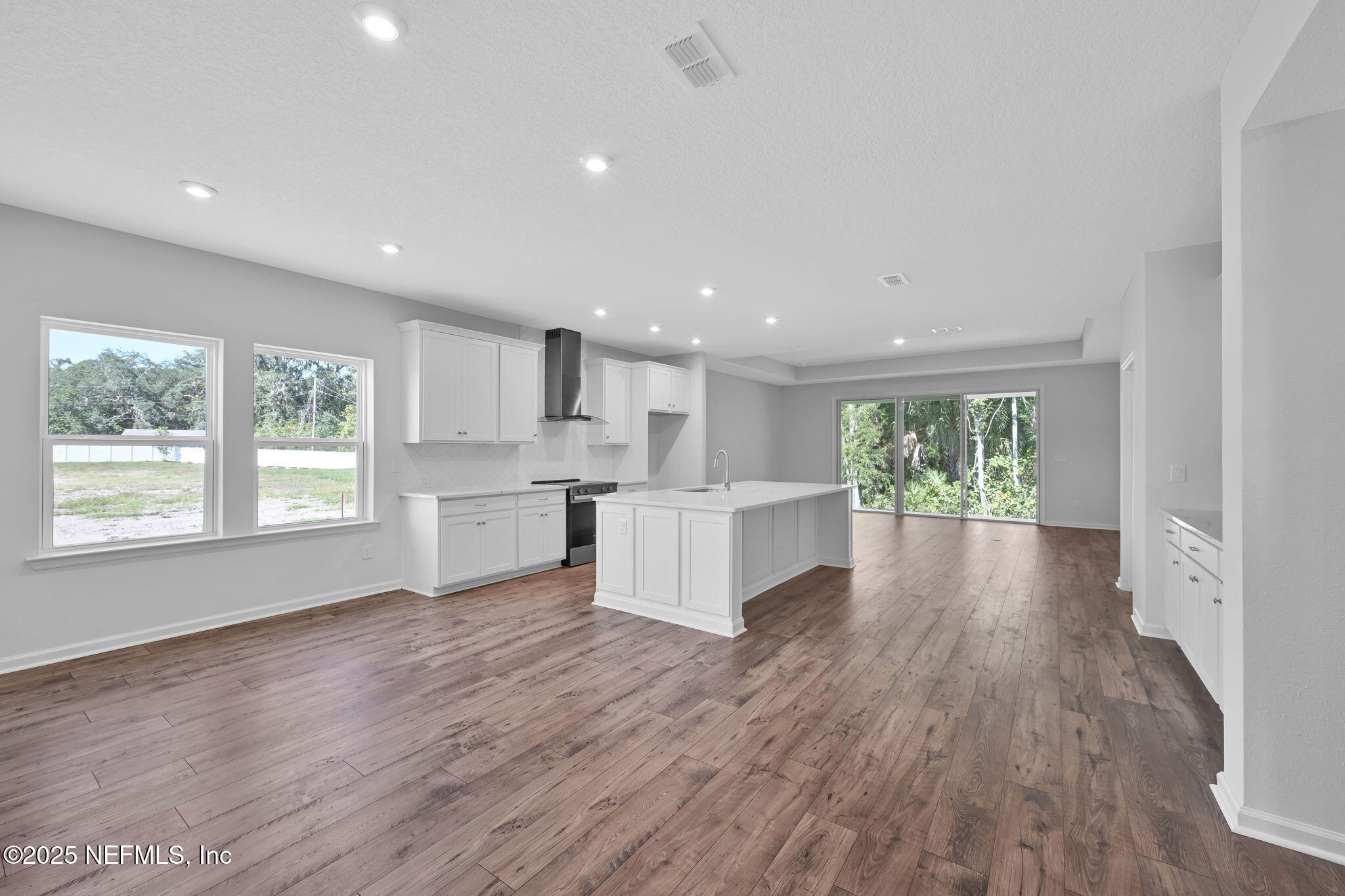 97003 Mcgirts Creek Loop Yulee, FL 32097 - Photo 21 of 40 a view of kitchen with wooden floor and windows