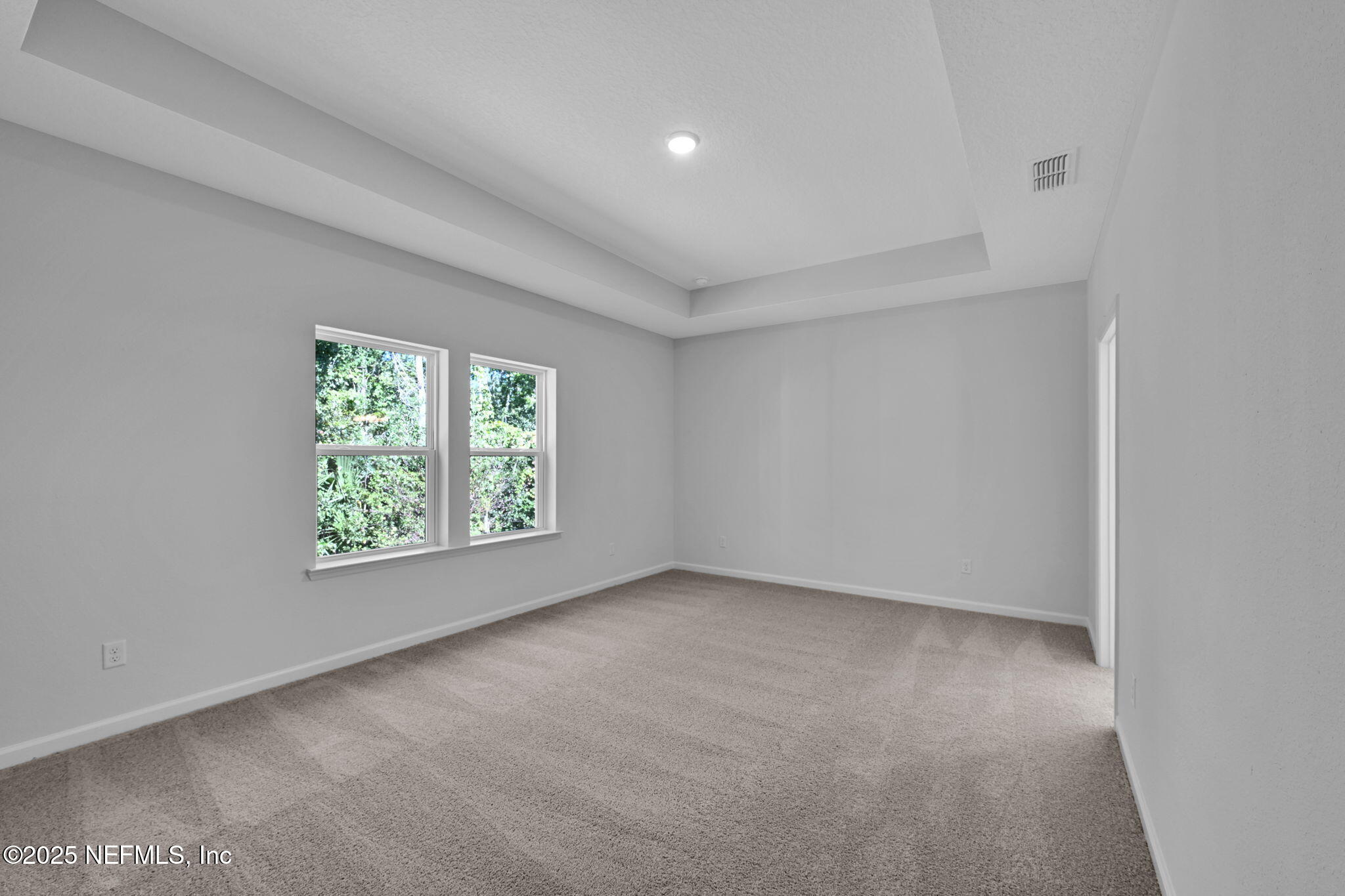 97003 Mcgirts Creek Loop Yulee, FL 32097 - Photo 22 of 40 an empty room with windows