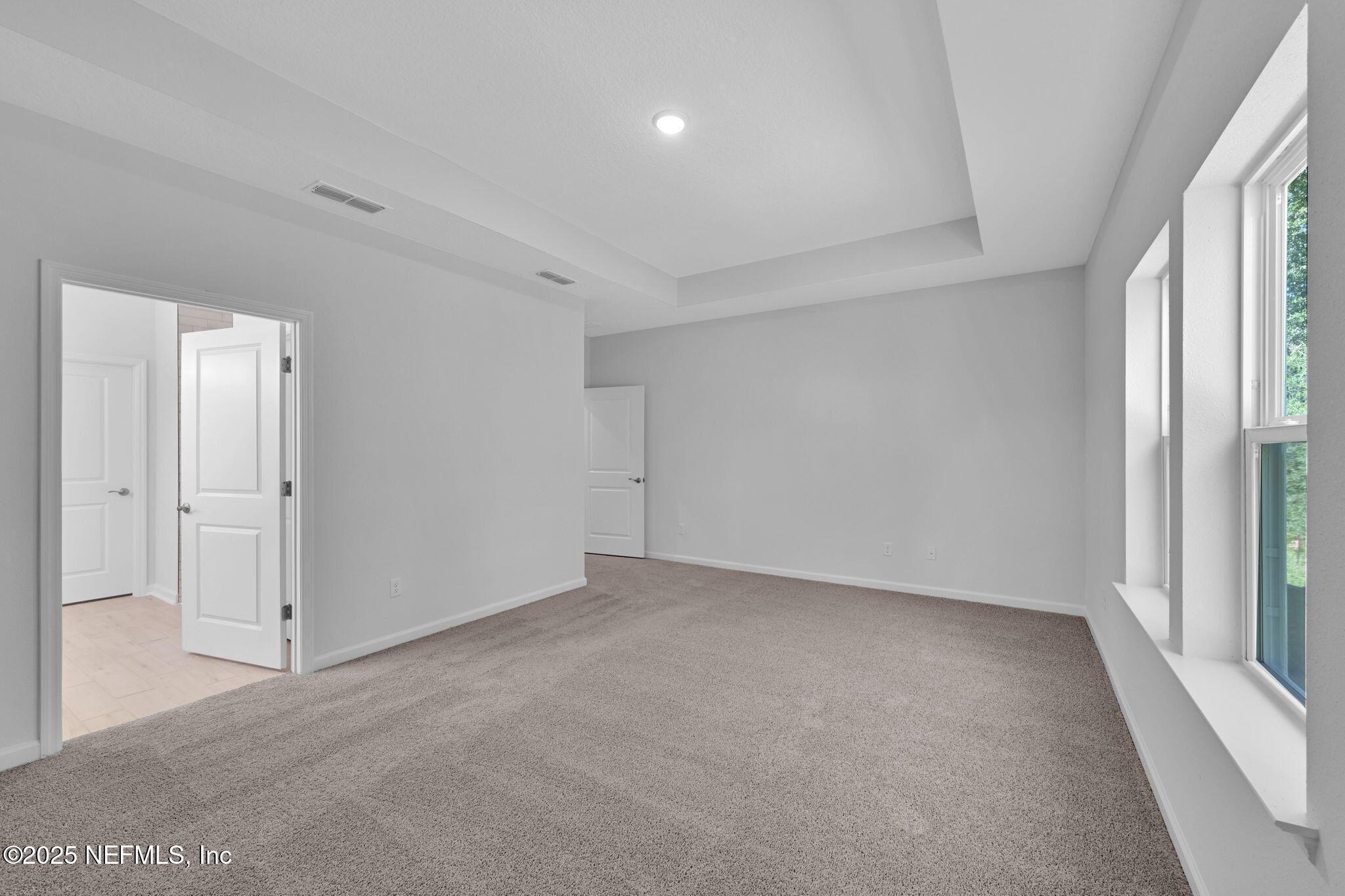 97003 Mcgirts Creek Loop Yulee, FL 32097 - Photo 23 of 40 an empty room with windows