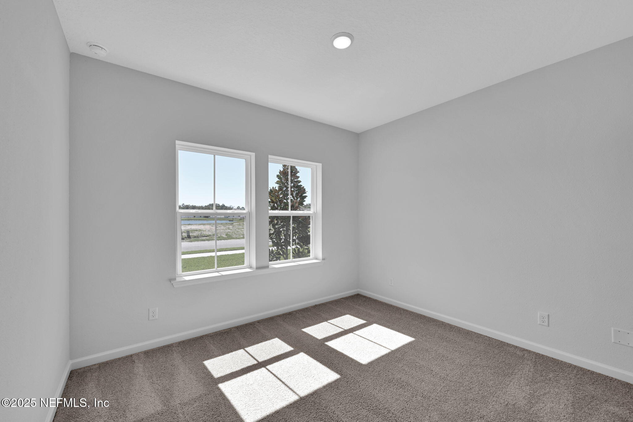 97003 Mcgirts Creek Loop Yulee, FL 32097 - Photo 27 of 40 an empty room with a window