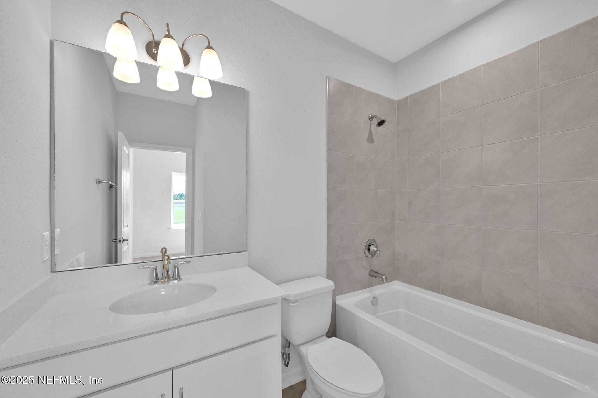 97003 Mcgirts Creek Loop Yulee, FL 32097 - Photo 28 of 40 a bathroom with a sink a toilet and bathtub