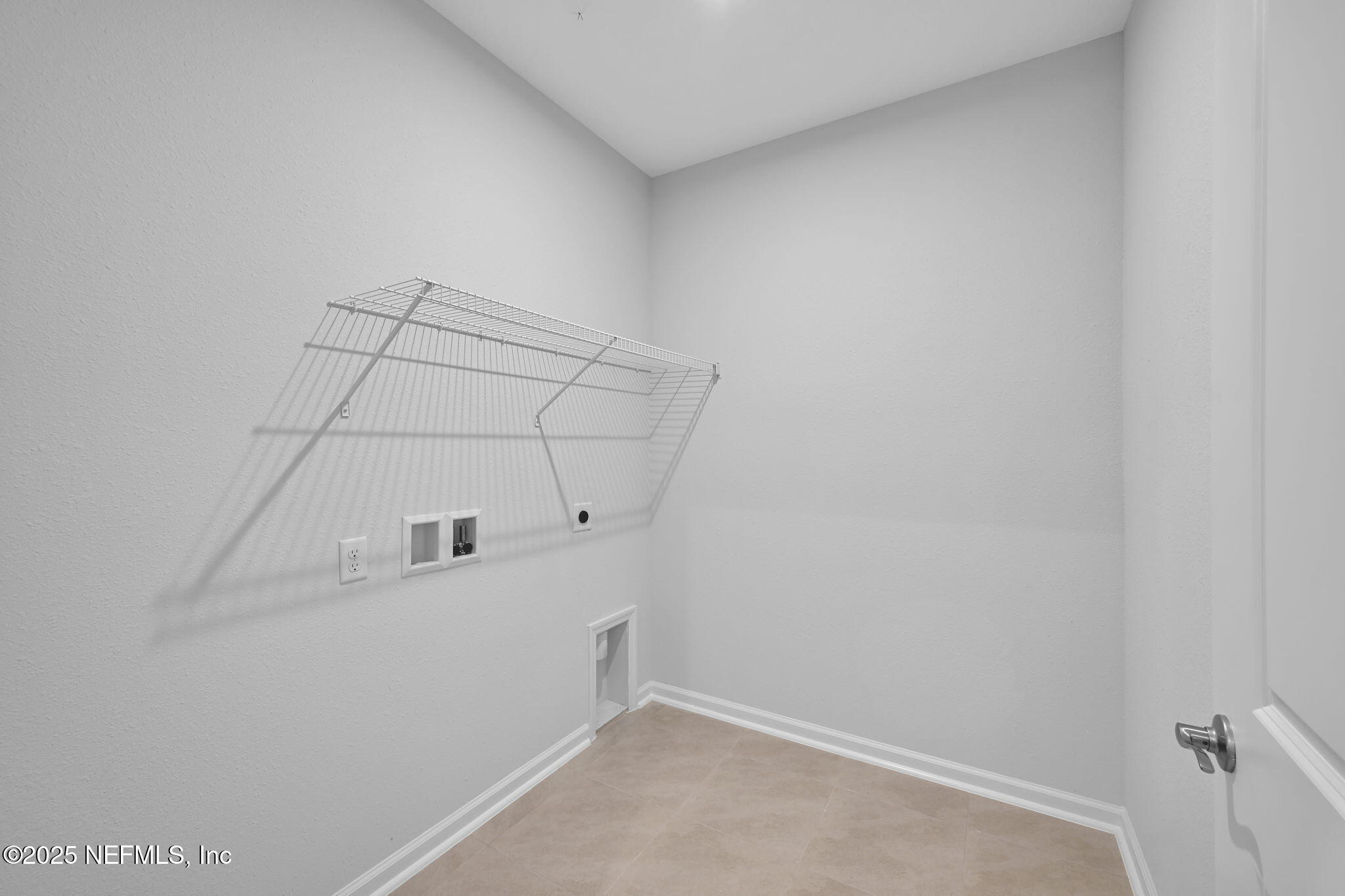 97003 Mcgirts Creek Loop Yulee, FL 32097 - Photo 32 of 40 a view of a room with racks on the wall