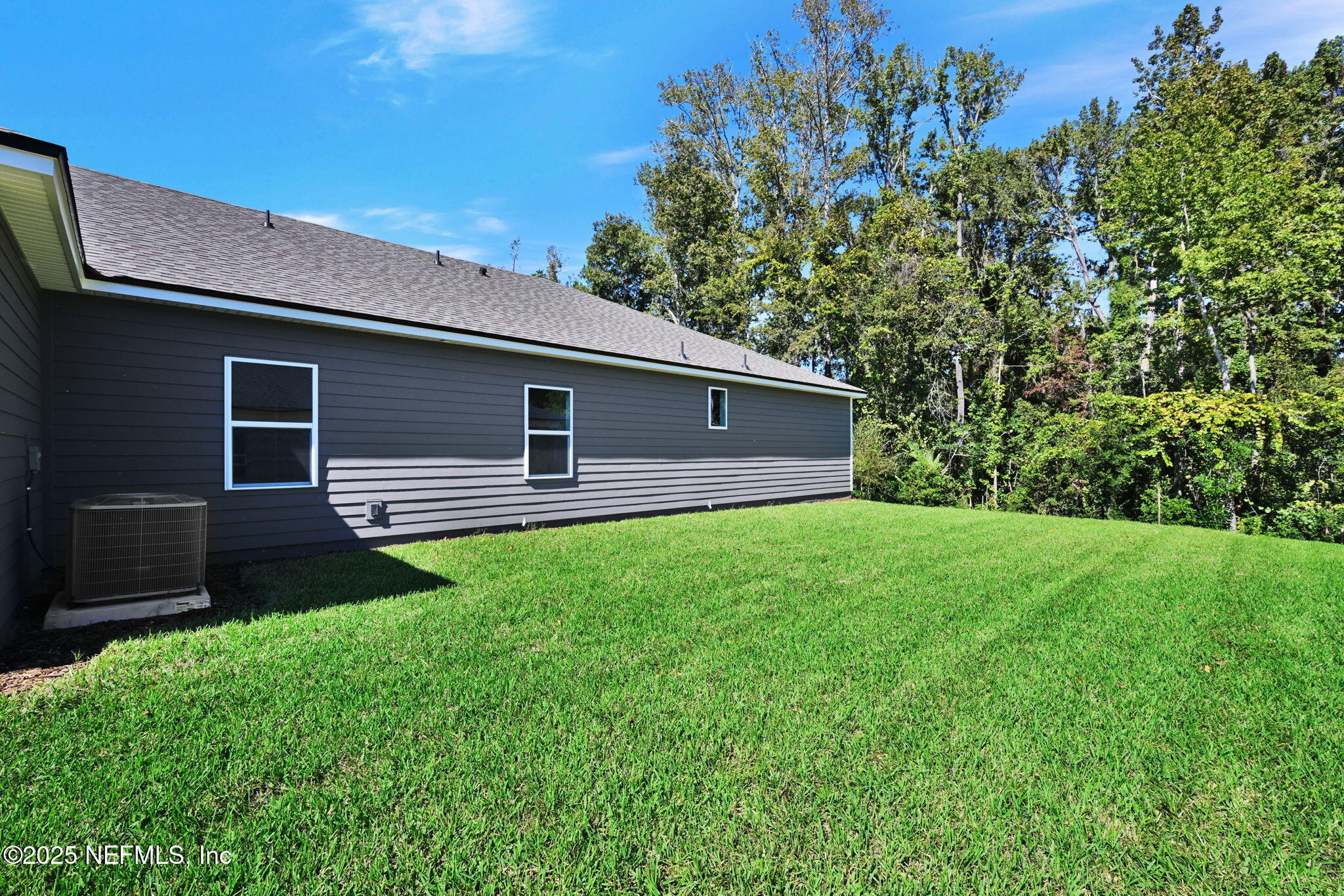 97003 Mcgirts Creek Loop Yulee, FL 32097 - Photo 34 of 40 a front view of a house with garden