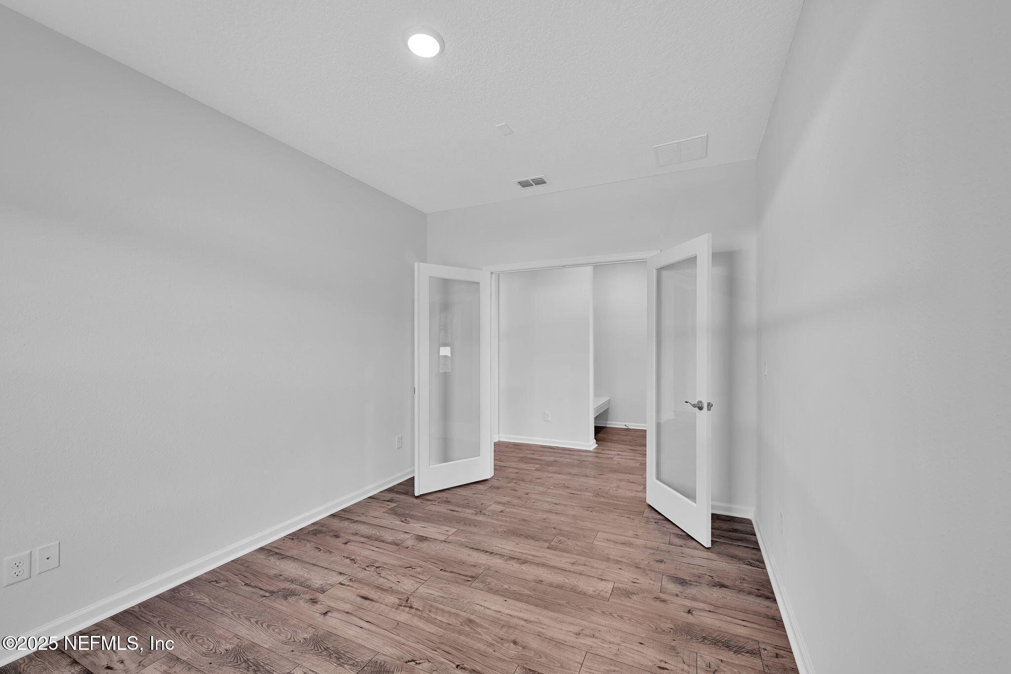 97003 Mcgirts Creek Loop Yulee, FL 32097 - Photo 7 of 40 a big room with wooden floor