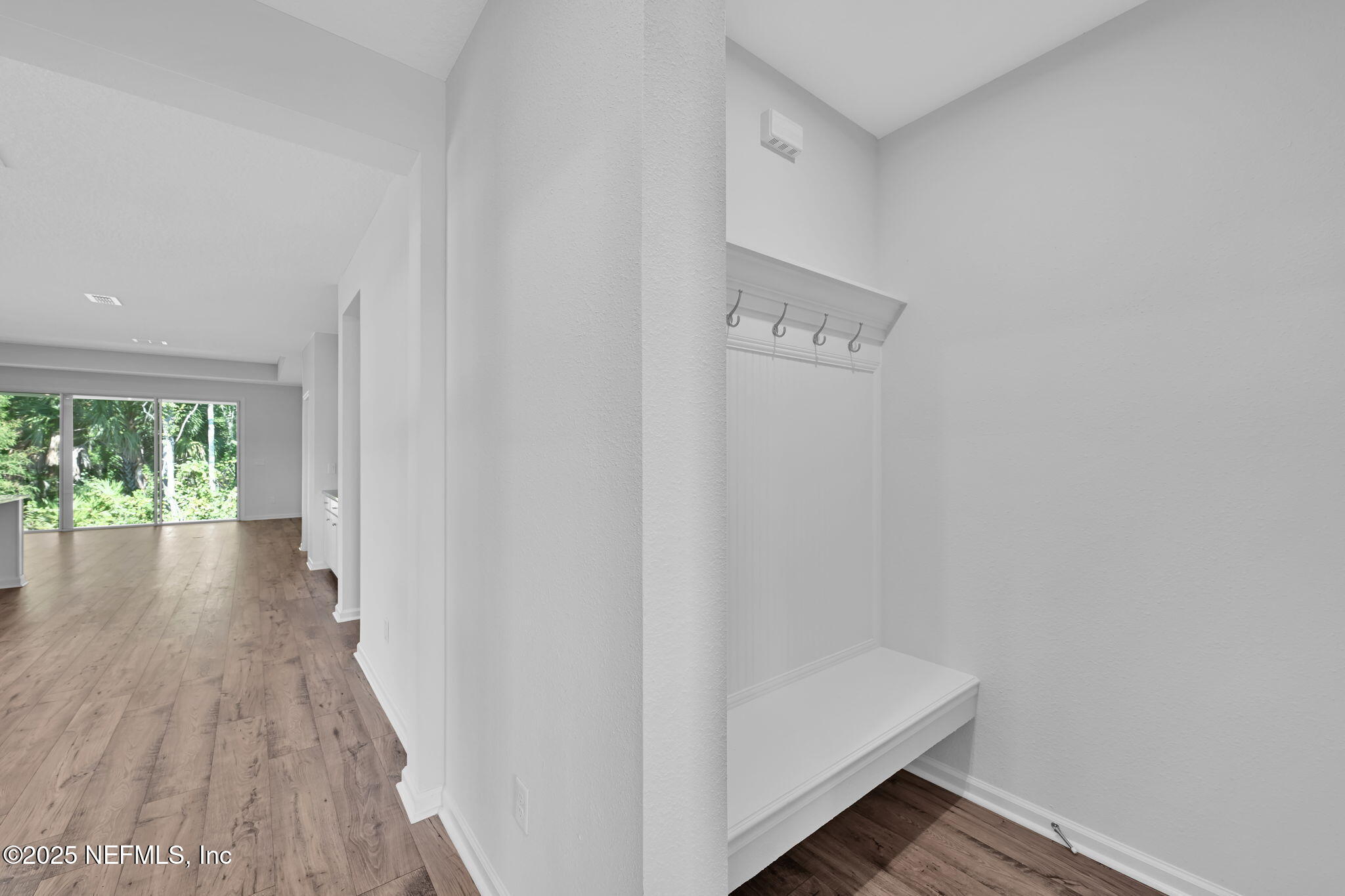 97003 Mcgirts Creek Loop Yulee, FL 32097 - Photo 8 of 40 a view of hallway with wooden floor