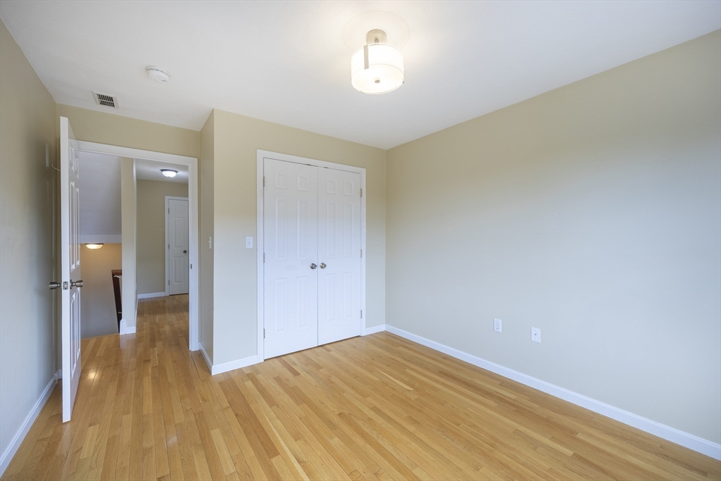54 Spruce Street Winchester, MA 01890 - Photo 17 of 29 a view of empty room with wooden floor