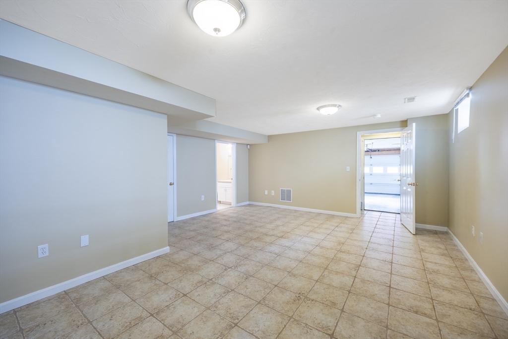54 Spruce Street Winchester, MA 01890 - Photo 25 of 29 a view of an empty room and window